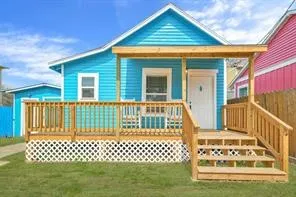 a front view of a house with a fence