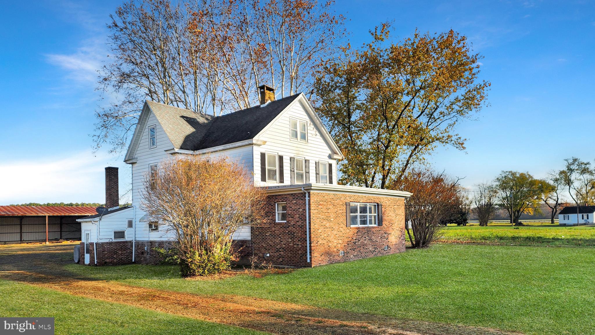 2431 Tulls Corner Road Pocomoke City, MD 21851 - Photo 23 of 28 a front view of house with yard and green space