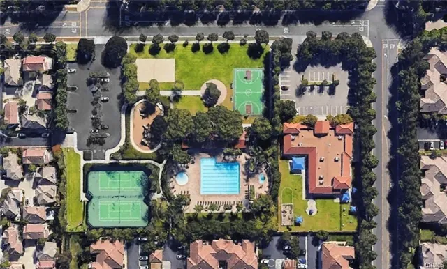 an aerial view of residential houses with outdoor space