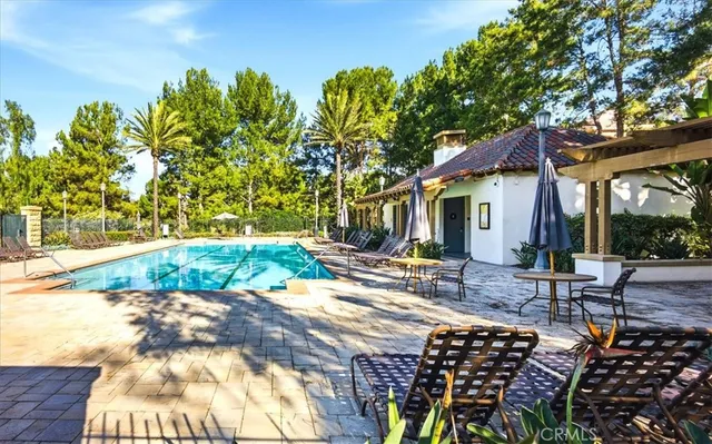 a view of a patio with chairs and plants