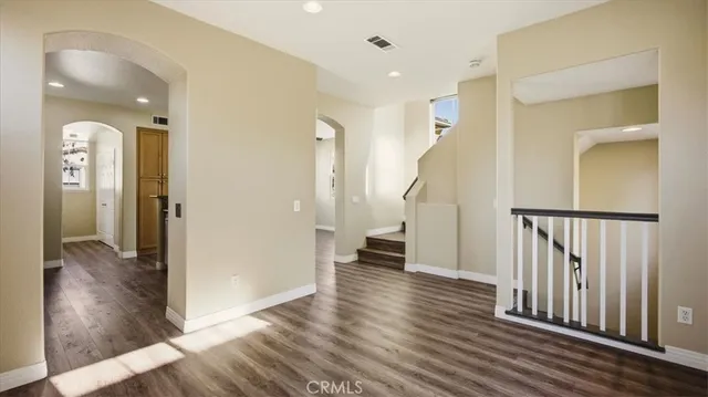 wooden floor in a hall with a mirror
