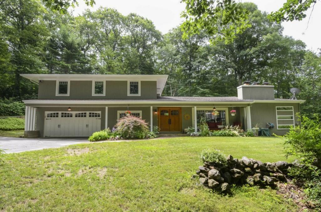 264 Wright Road Canton, CT 06019 - Photo 1 of 1 a front view of house with yard and green space