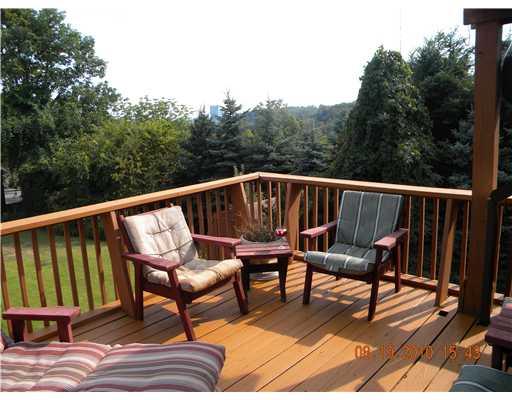 3053 Mt Troy Road Pittsburgh, PA 15212 - Photo 8 of 16 View. Kitchen leads to wrap around deck with beautiful views AND Pittsburgh in the background.