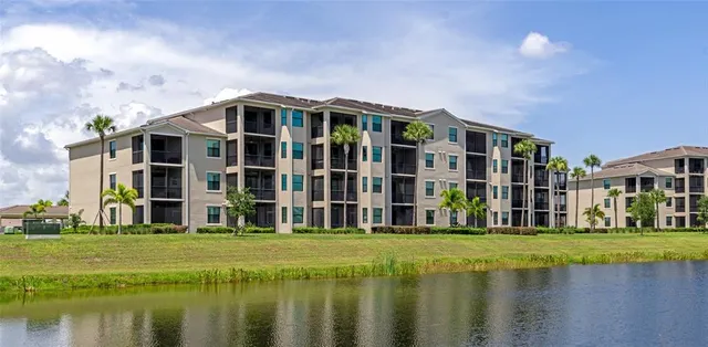 a view of a garden with a building in the background