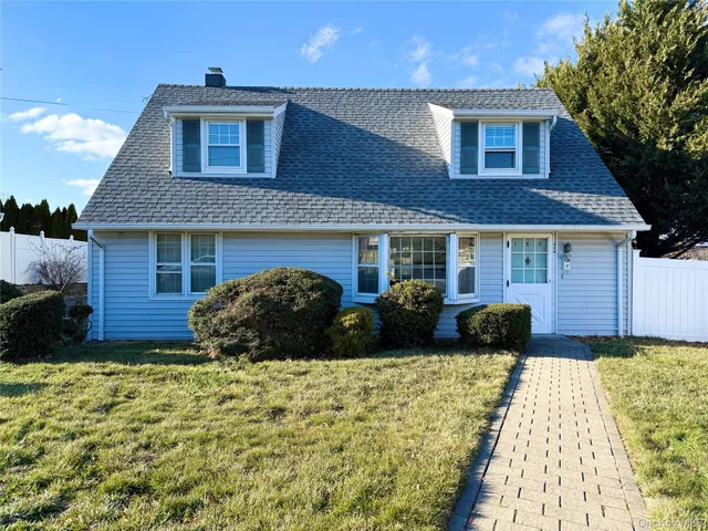 a view of house with yard and outdoor space