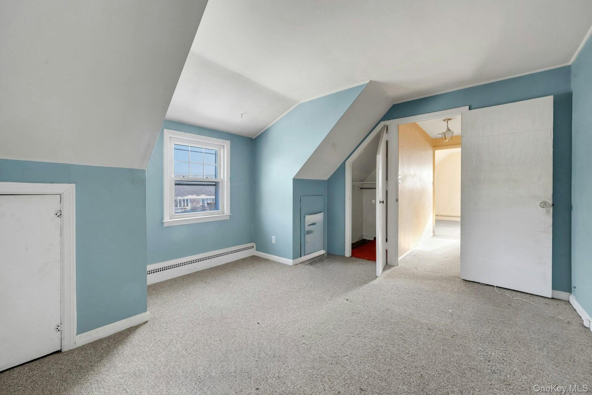 155 Mountaindale Road Yonkers, NY 10710 - Photo 16 of 24 an empty room with windows and entrance