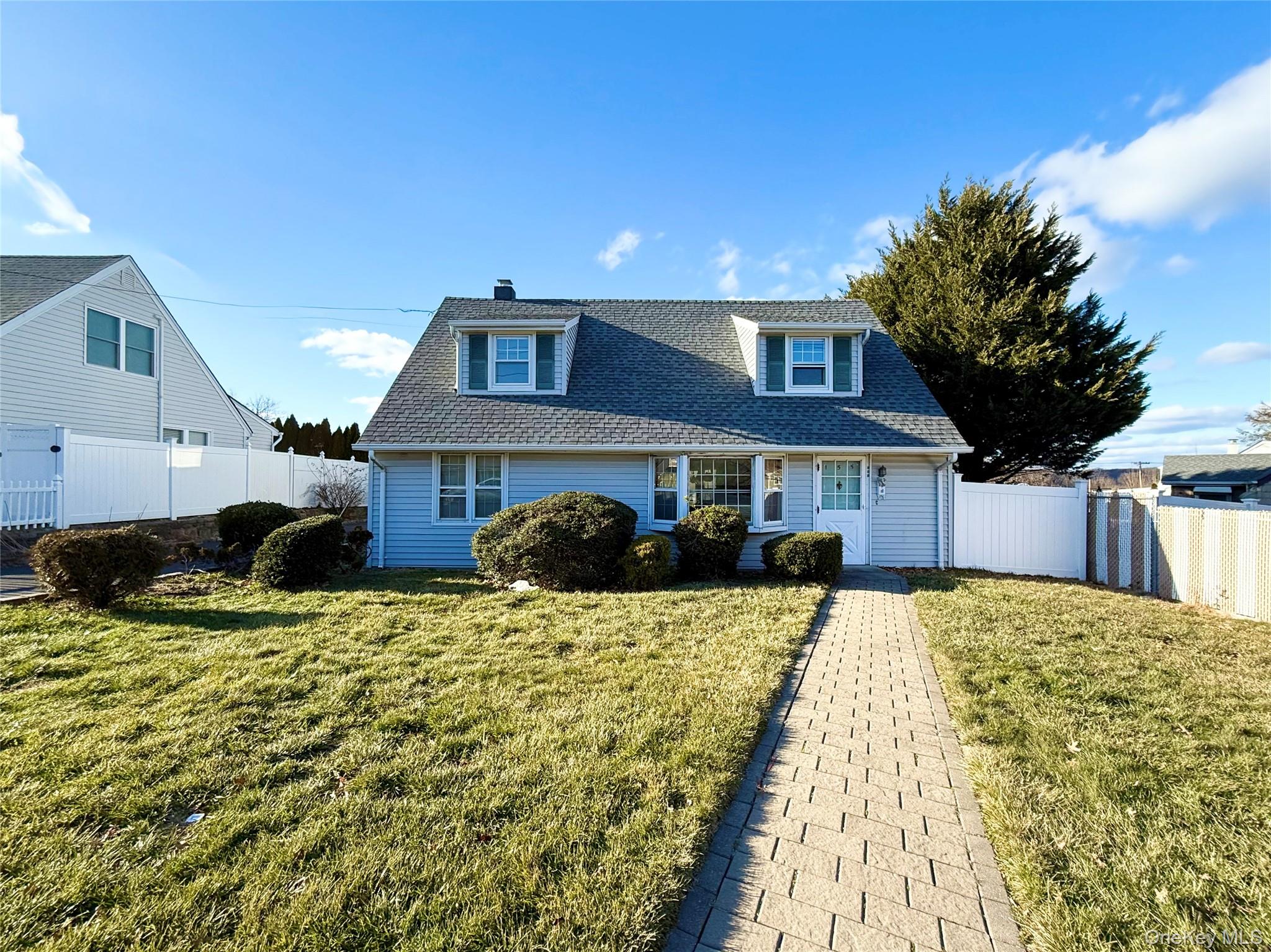 155 Mountaindale Road Yonkers, NY 10710 - Photo 3 of 24 a front view of a house with a yard