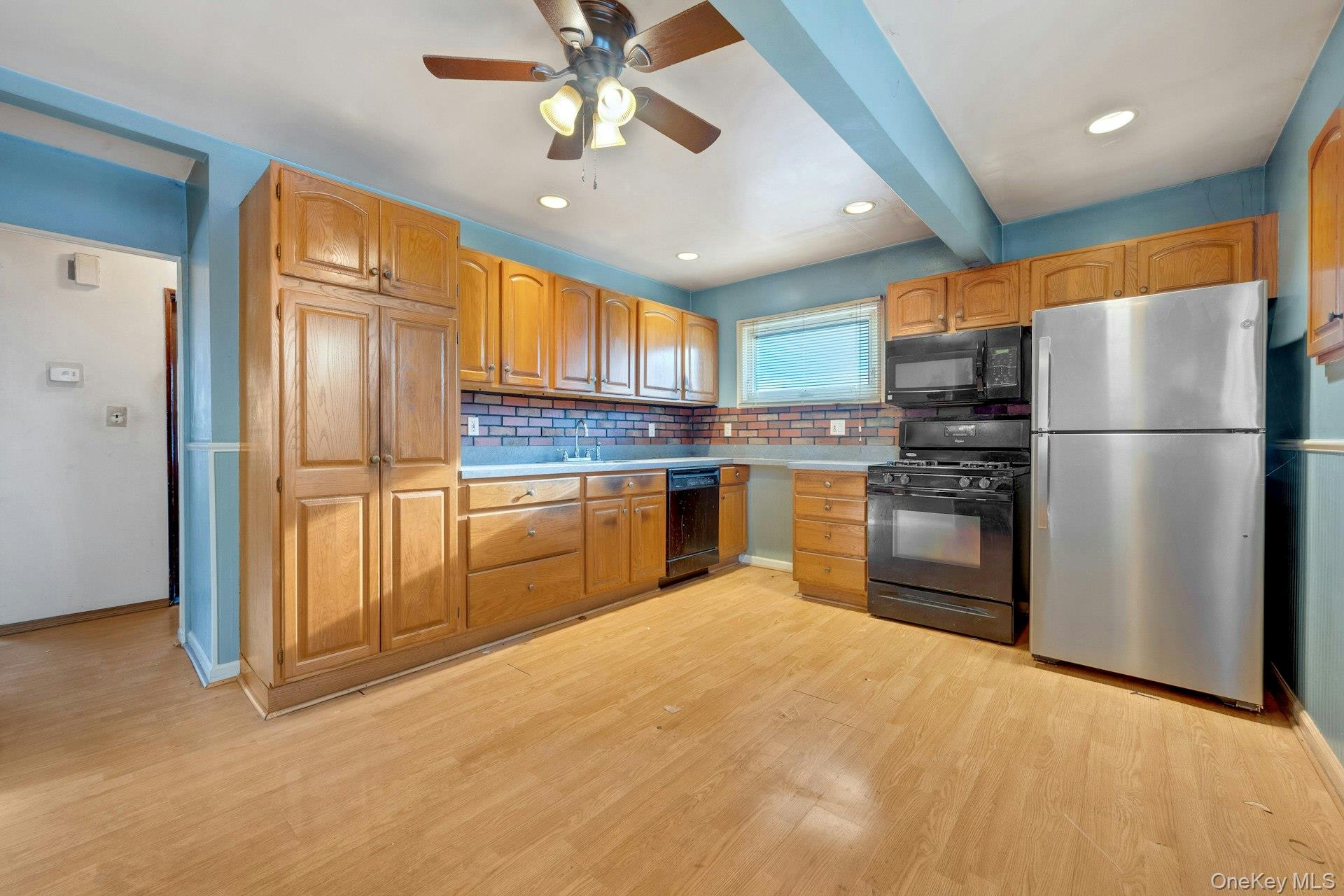 155 Mountaindale Road Yonkers, NY 10710 - Photo 5 of 24 a kitchen with granite countertop stainless steel appliances a refrigerator sink and microwave