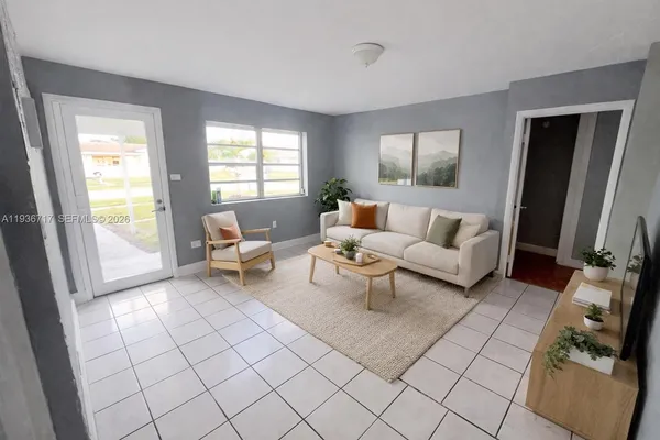 a living room with furniture and a window