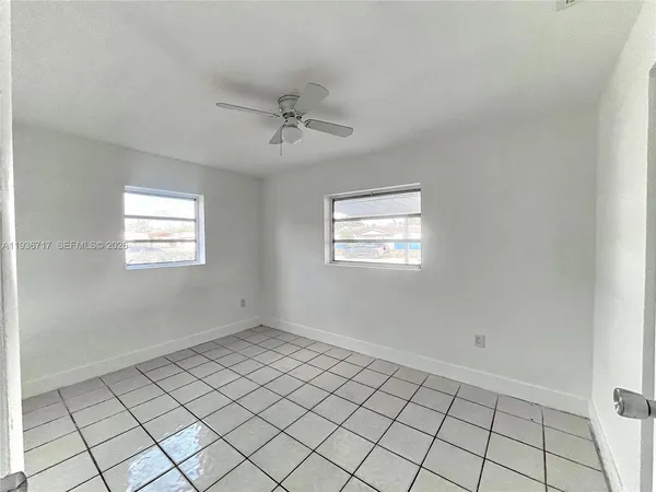 a view of an empty room and window