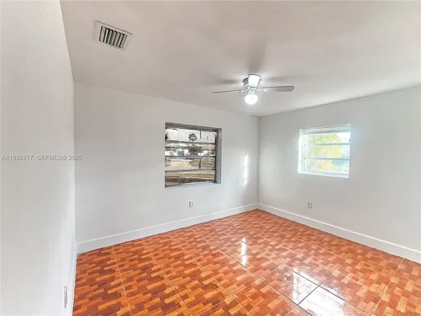 a view of an empty room with a window