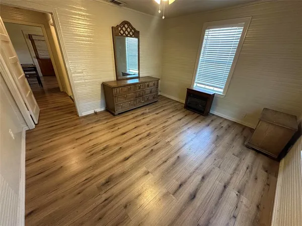 a view of a hardwood floor and staircase