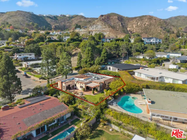 an aerial view of residential houses and outdoor space
