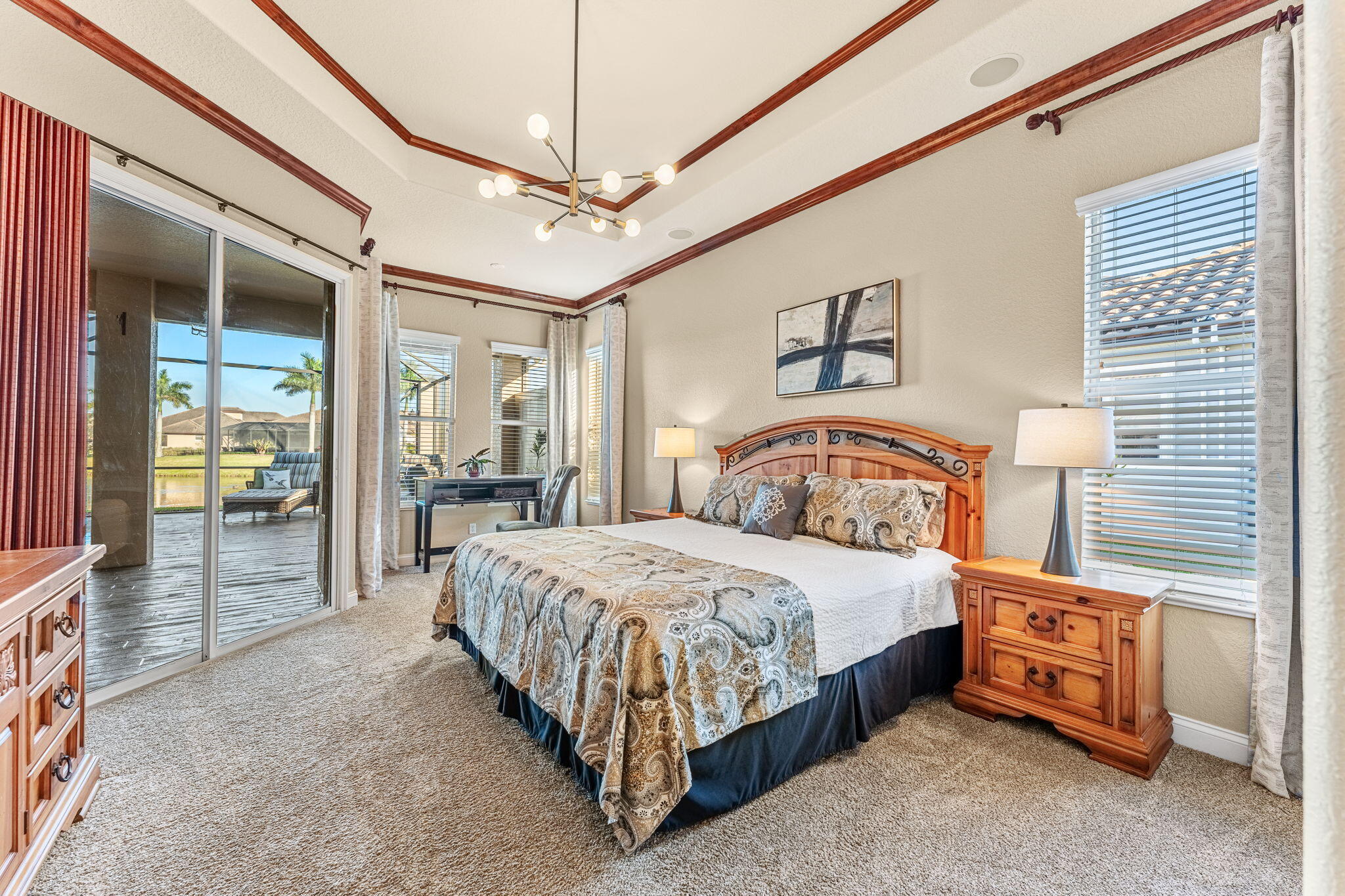 5139 Duson Way Rockledge, FL 32955 - Photo 15 of 48 a bedroom with a bed and a chandelier