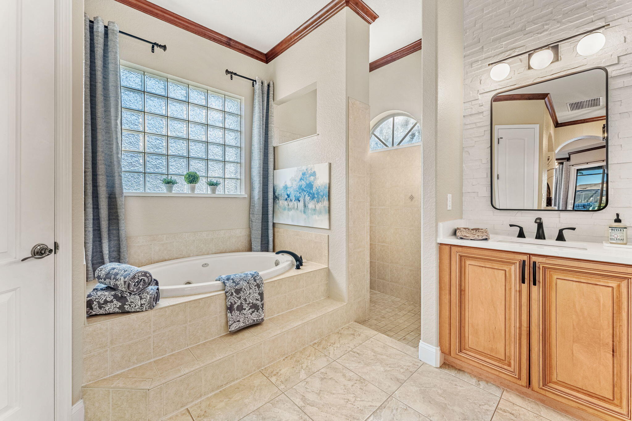 5139 Duson Way Rockledge, FL 32955 - Photo 18 of 48 a spacious bathroom with a double vanity sink and a mirror