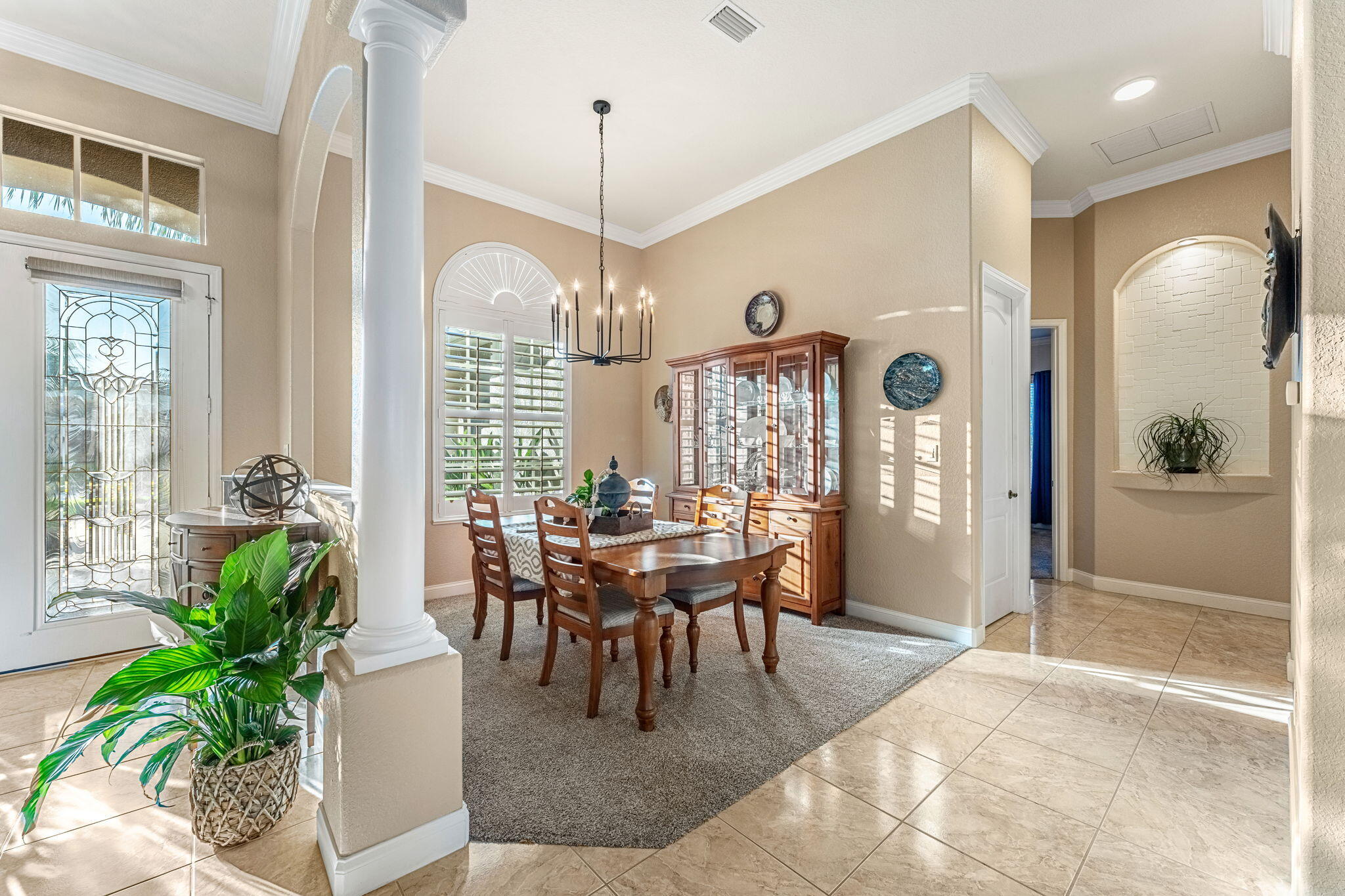 5139 Duson Way Rockledge, FL 32955 - Photo 23 of 48 a dining room with furniture a chandelier and a rug