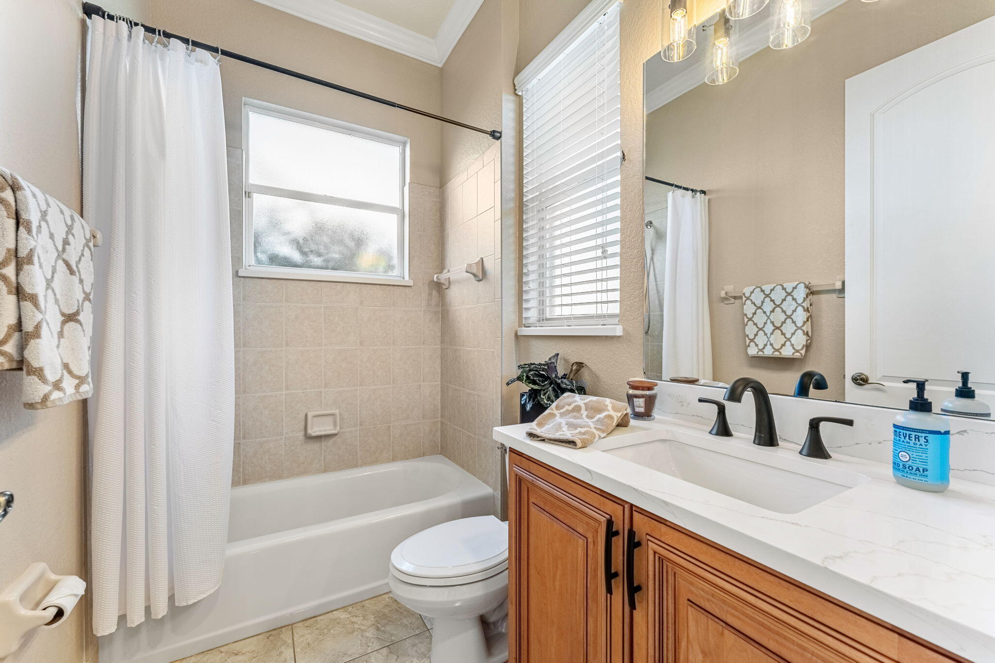 5139 Duson Way Rockledge, FL 32955 - Photo 31 of 48 a bathroom with a granite countertop sink toilet and shower