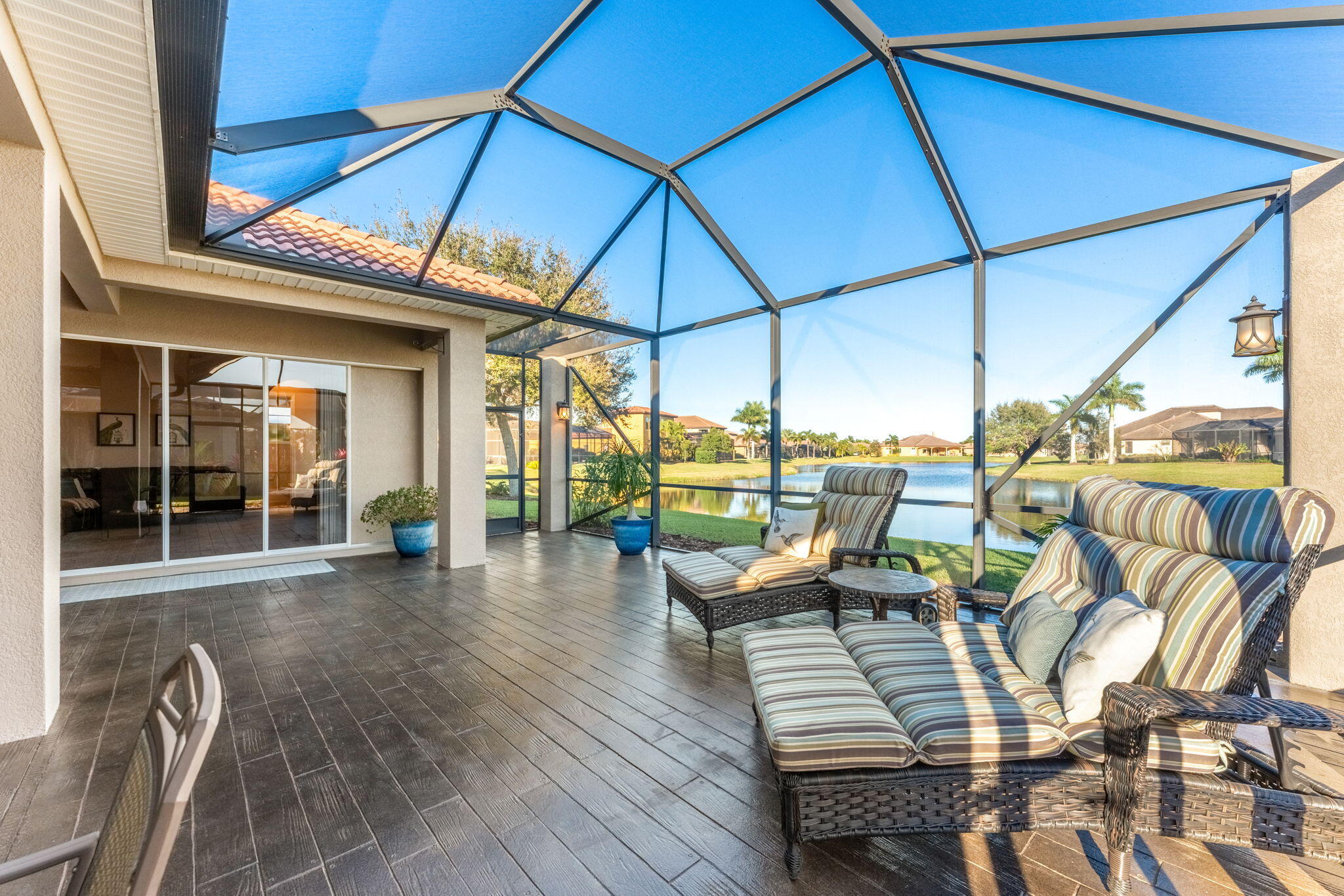 5139 Duson Way Rockledge, FL 32955 - Photo 32 of 48 a view of a patio with table and chairs under an umbrella
