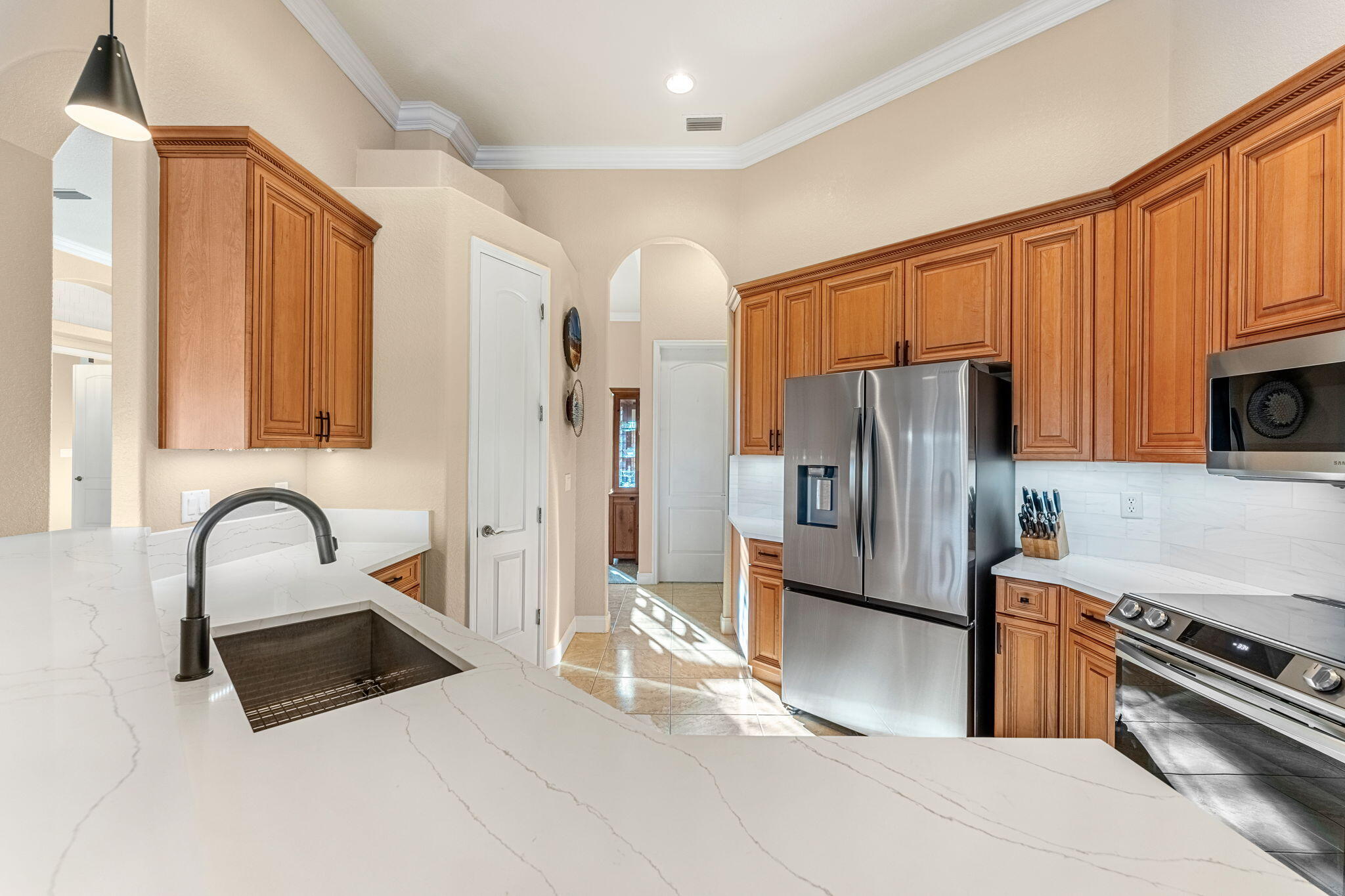 5139 Duson Way Rockledge, FL 32955 - Photo 4 of 48 a kitchen with stainless steel appliances a refrigerator sink and stove
