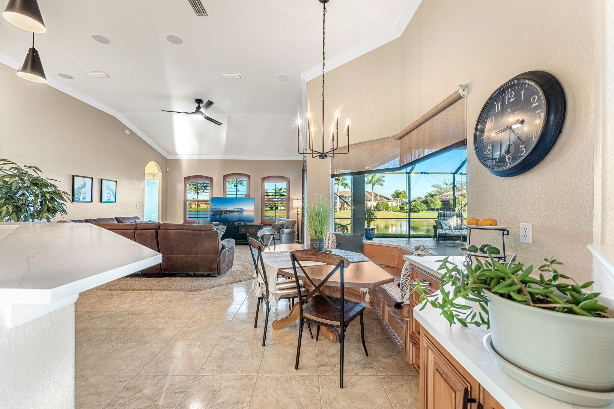 5139 Duson Way Rockledge, FL 32955 - Photo 9 of 48 a living room with furniture a chandelier and a large window