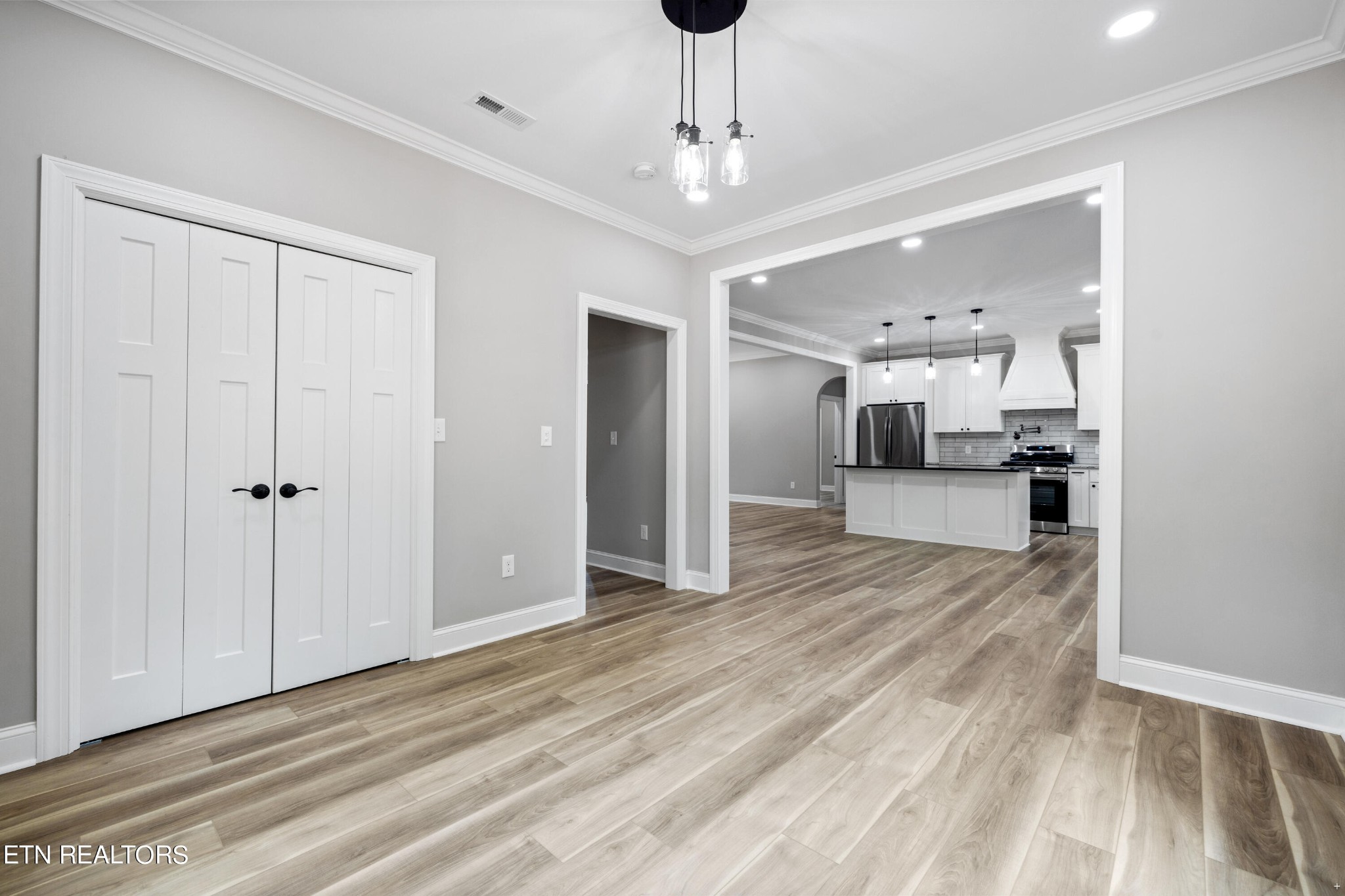 2333 Mountain View Road Lenoir City, TN 37771 - Photo 19 of 54 a view of a hallway with wooden floor and a kitchen