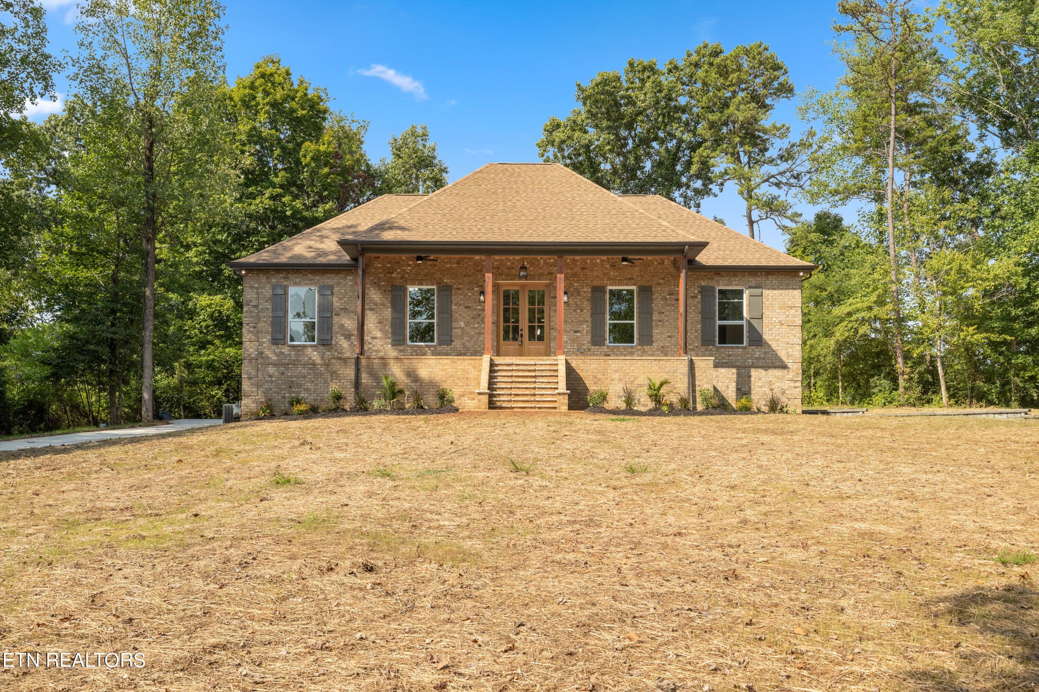 2333 Mountain View Road Lenoir City, TN 37771 - Photo 2 of 54 a front view of a house with a yard