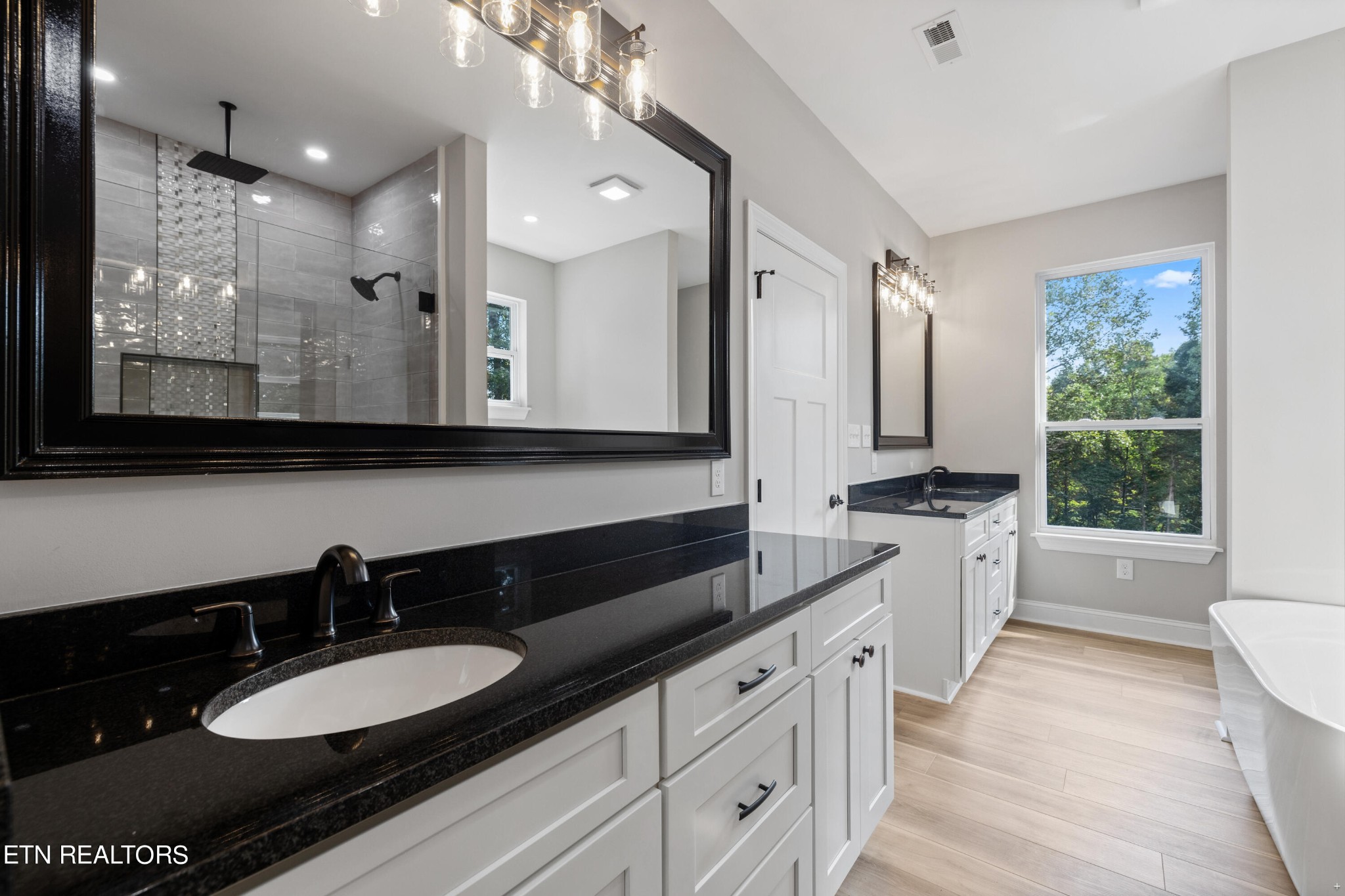 2333 Mountain View Road Lenoir City, TN 37771 - Photo 23 of 54 a bathroom with a sink double vanity granite and a mirror