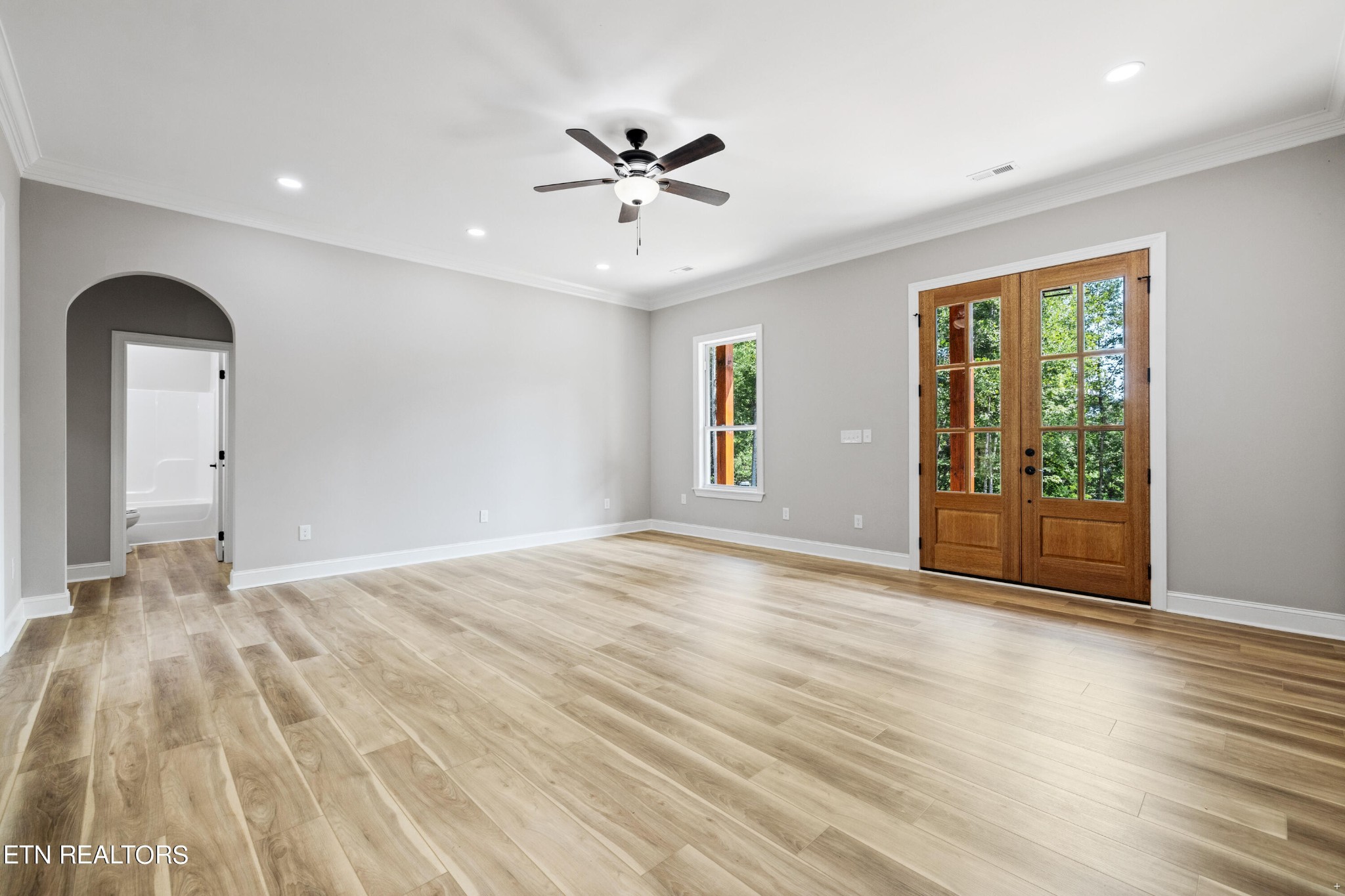 2333 Mountain View Road Lenoir City, TN 37771 - Photo 30 of 54 a view of empty room with wooden floor and fan
