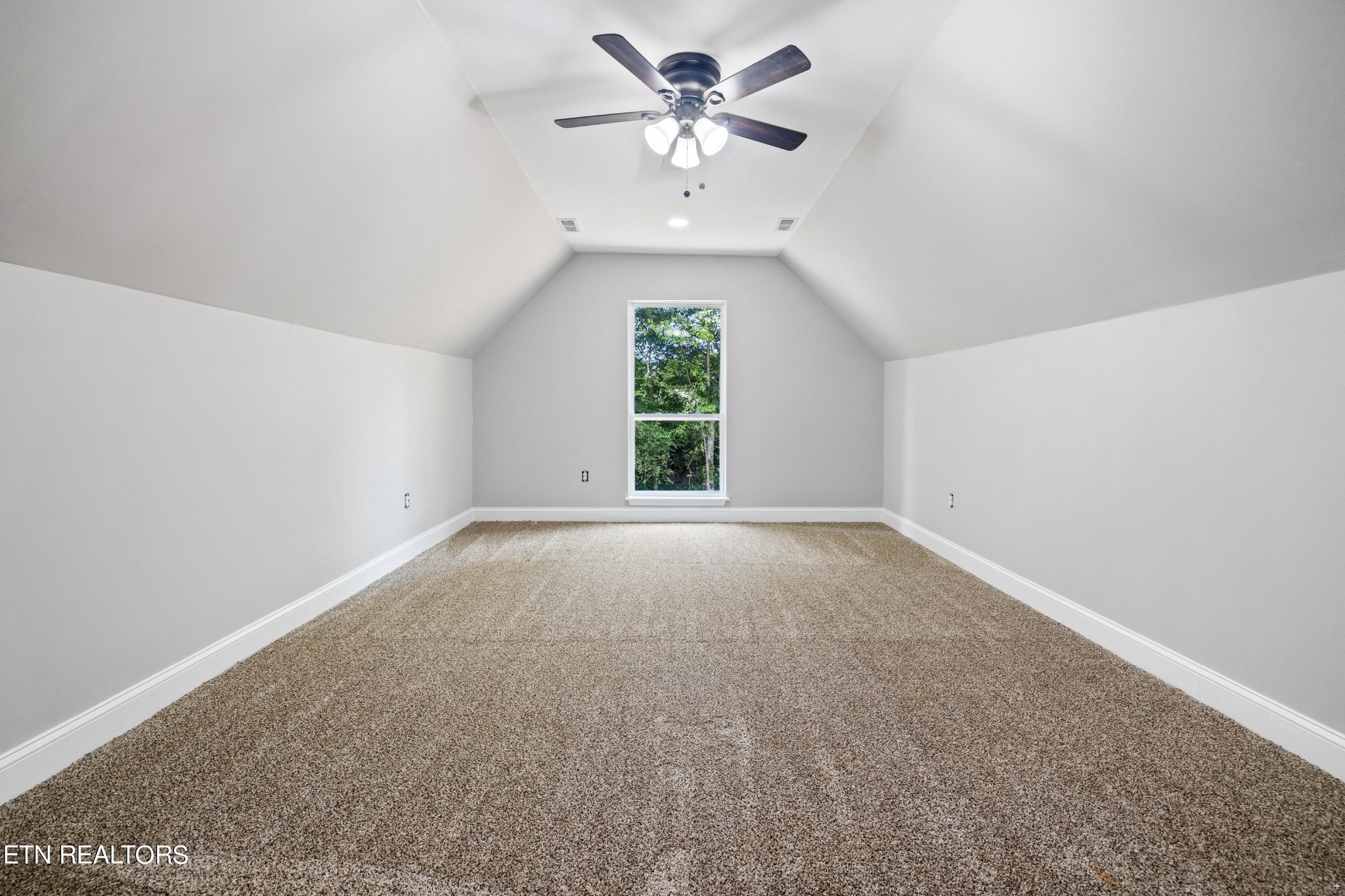 2333 Mountain View Road Lenoir City, TN 37771 - Photo 33 of 54 an empty room with a window and a ceiling fan