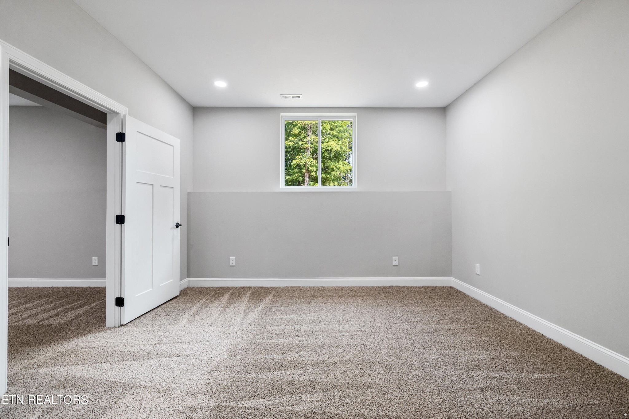 2333 Mountain View Road Lenoir City, TN 37771 - Photo 47 of 54 wooden floor in an empty room with a window