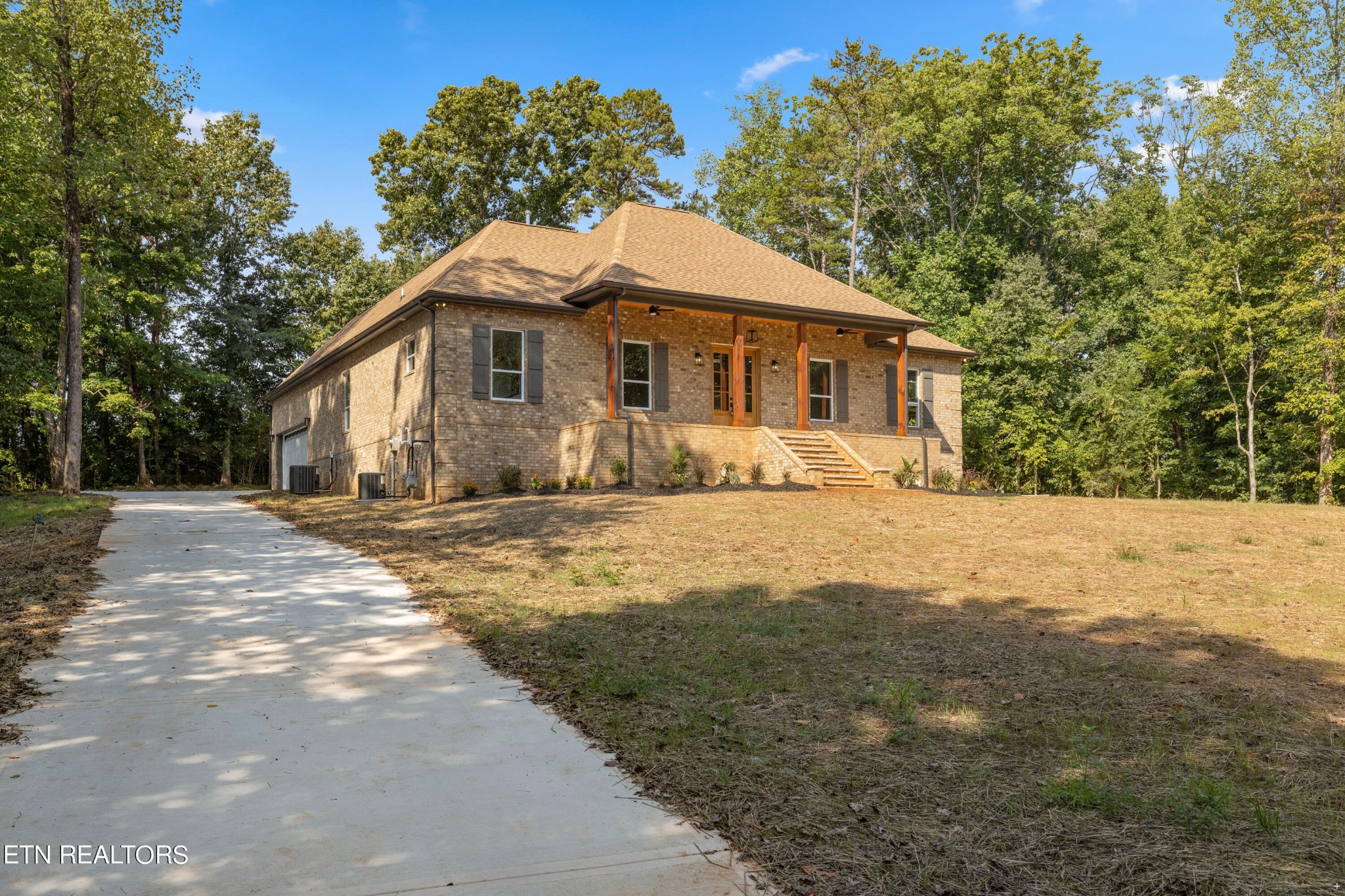 2333 Mountain View Road Lenoir City, TN 37771 - Photo 6 of 54 a front view of a house with a yard