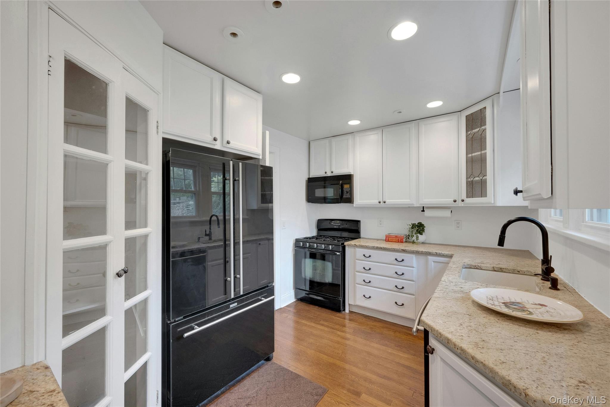 1179 Post Road Scarsdale, NY 10583 - Photo 9 of 24 Kitchen with gas range, built in microwave, dishwasher, double wide refrigerator with freezer draw botto,.