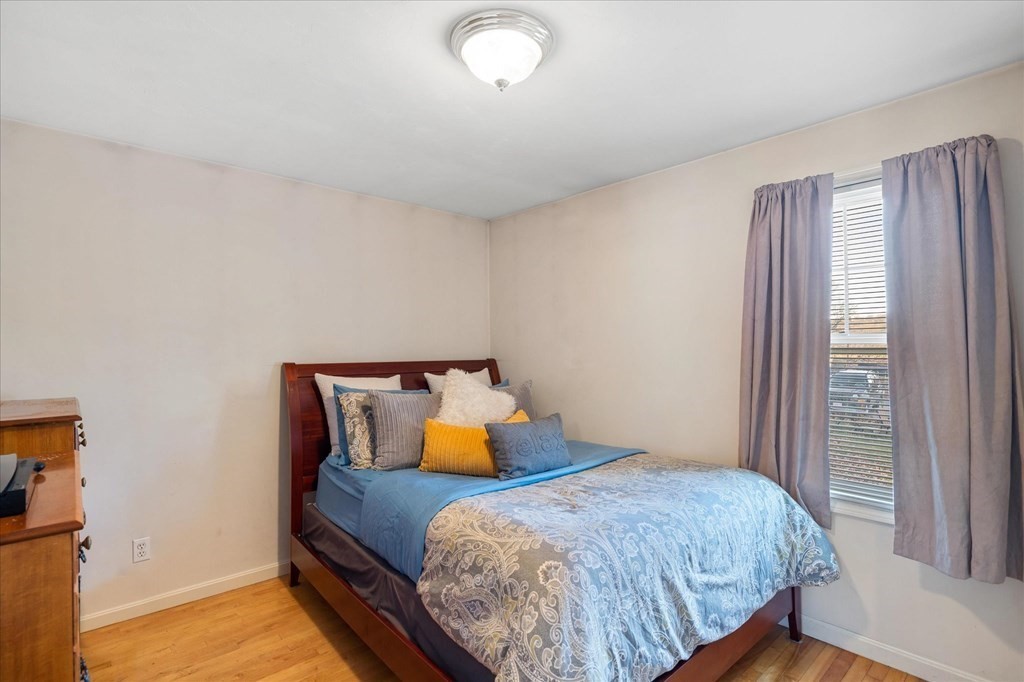 20 Alpine Trail Auburn, MA 01501 - Photo 12 of 25 a bedroom with a bed and wooden floor