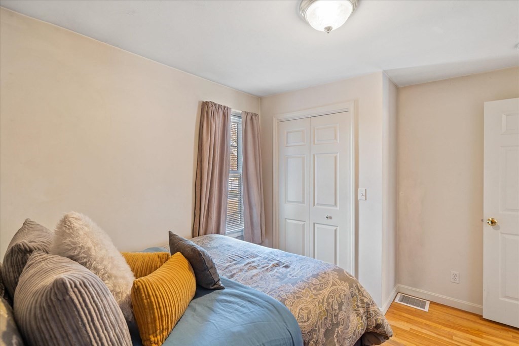 20 Alpine Trail Auburn, MA 01501 - Photo 13 of 25 a bedroom with a bed and wooden floor