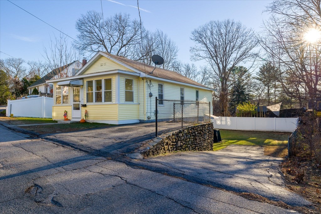 20 Alpine Trail Auburn, MA 01501 - Photo 2 of 25 a front view of a house with a yard and garage