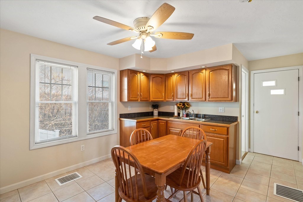20 Alpine Trail Auburn, MA 01501 - Photo 3 of 25 a kitchen with a stove a sink and a refrigerator