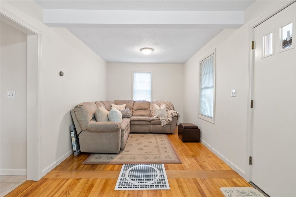20 Alpine Trail Auburn, MA 01501 - Photo 6 of 25 a living room with a couch and a rug