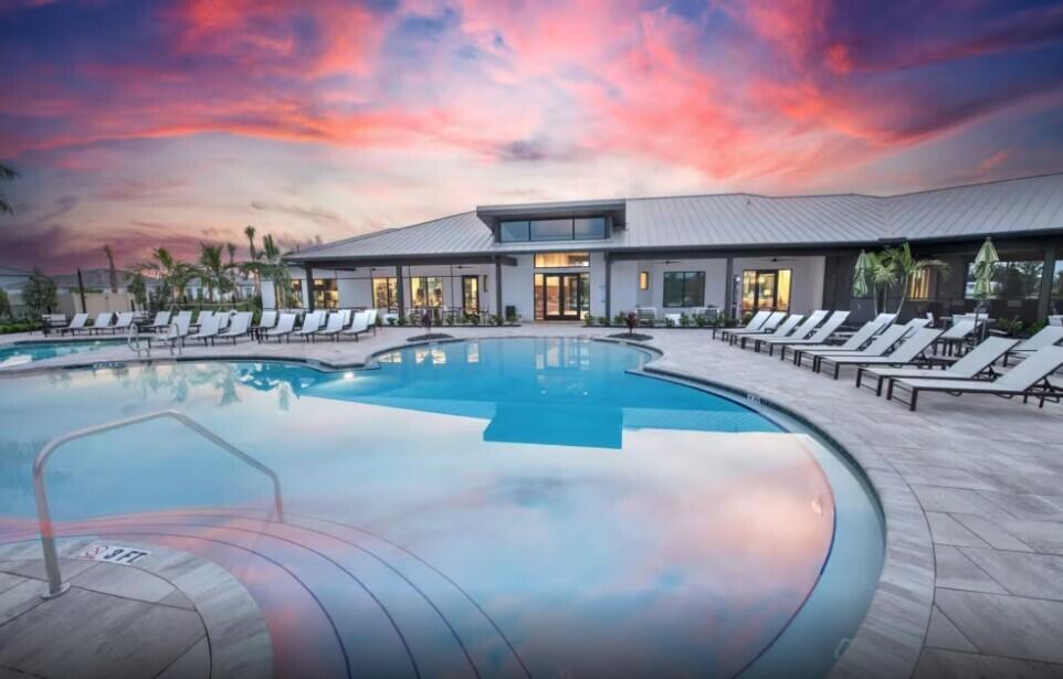 4925 Southwest Cornerstone Way, Unit MYSTIQUE 219 Stuart, FL 34997 - Photo 26 of 30 a view of a swimming pool with outdoor seating