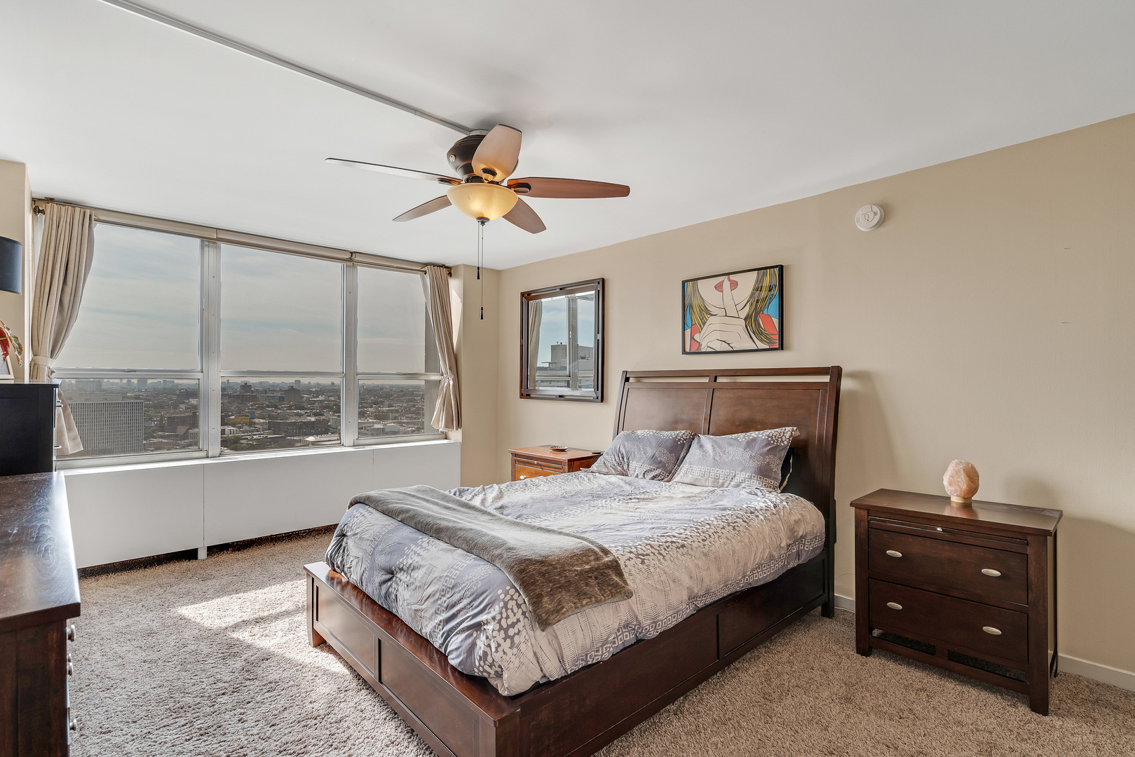 655 West Irving Park Road, Unit 2401 Chicago, IL 60613 - Photo 16 of 32 a bedroom with a bed and a window