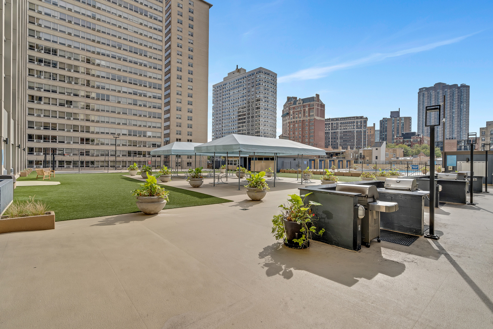 655 West Irving Park Road, Unit 2401 Chicago, IL 60613 - Photo 25 of 32 a view of a swimming pool and outdoor space