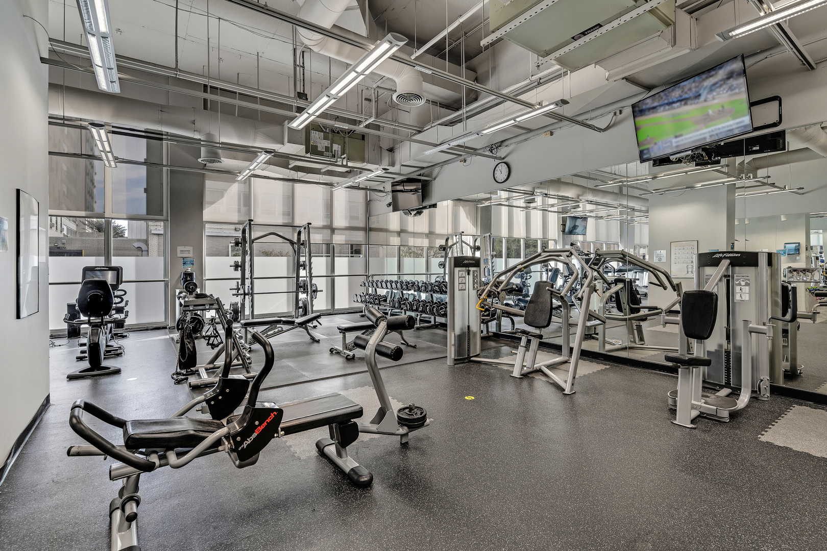 655 West Irving Park Road, Unit 2401 Chicago, IL 60613 - Photo 27 of 32 a view of a room with gym equipment