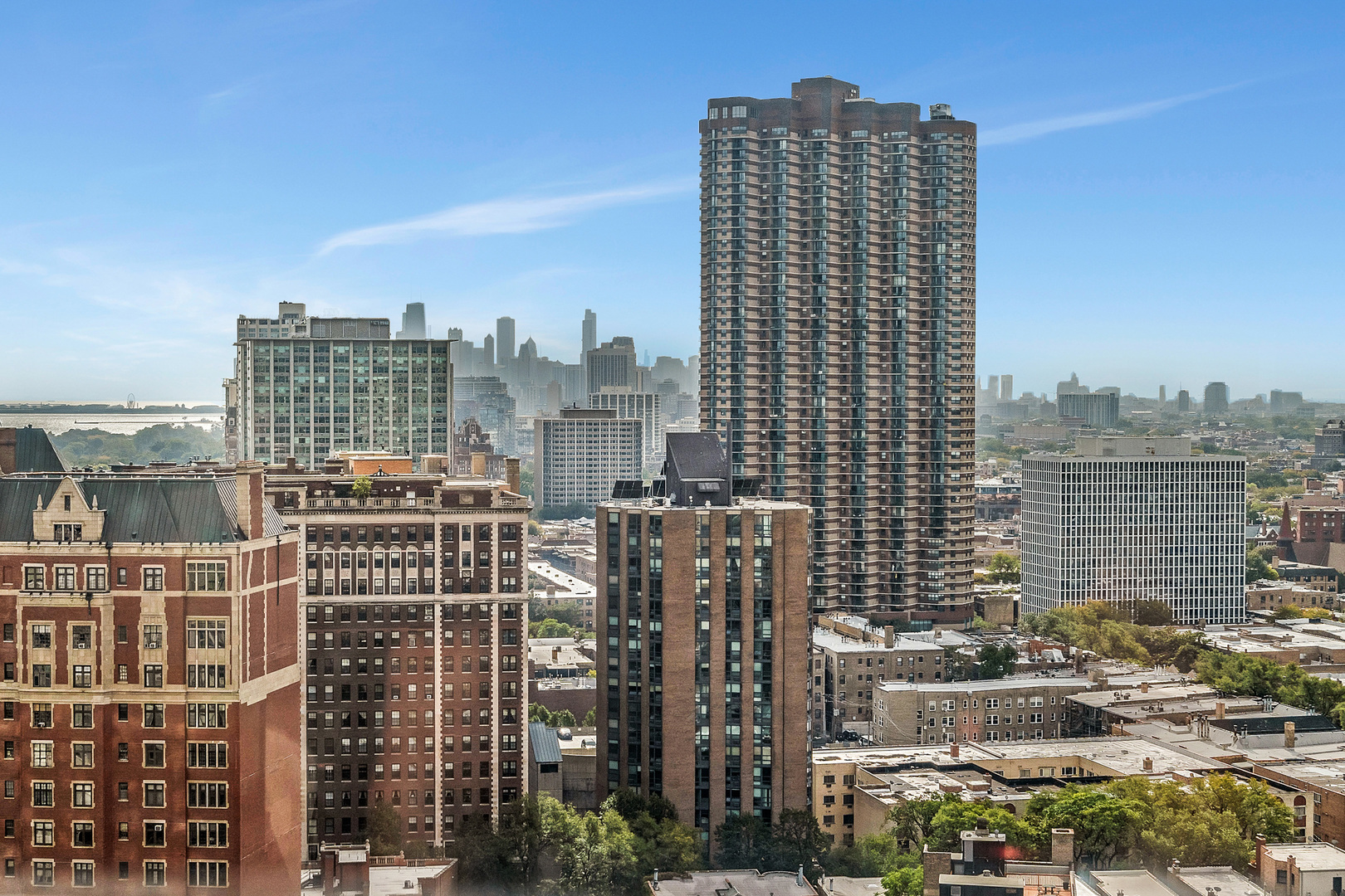 655 West Irving Park Road, Unit 2401 Chicago, IL 60613 - Photo 8 of 32 a city view with tall buildings