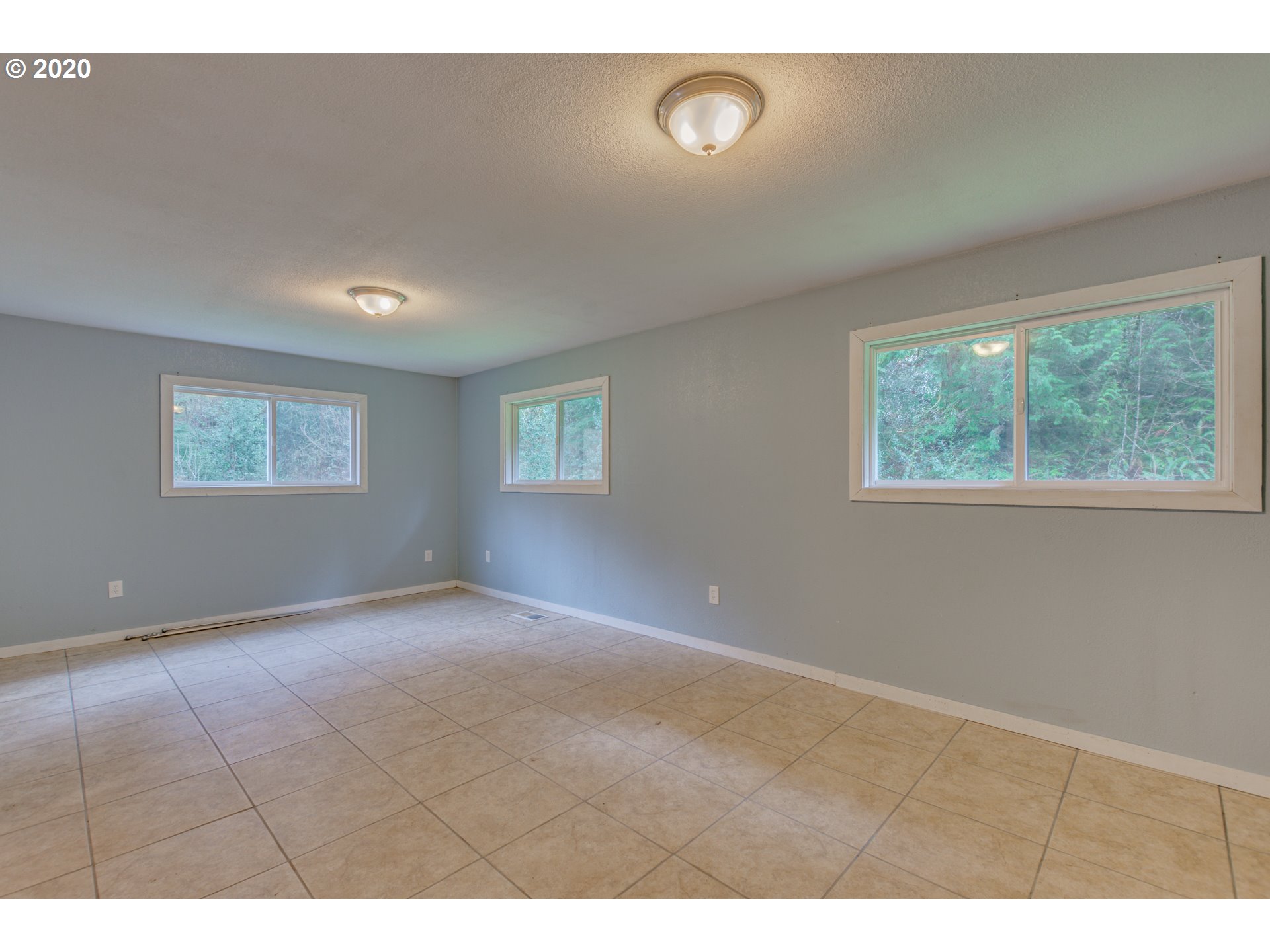 8767 Southeast Bull Run Road Corbett, OR 97019 - Photo 18 of 32 a view of an empty room with a window