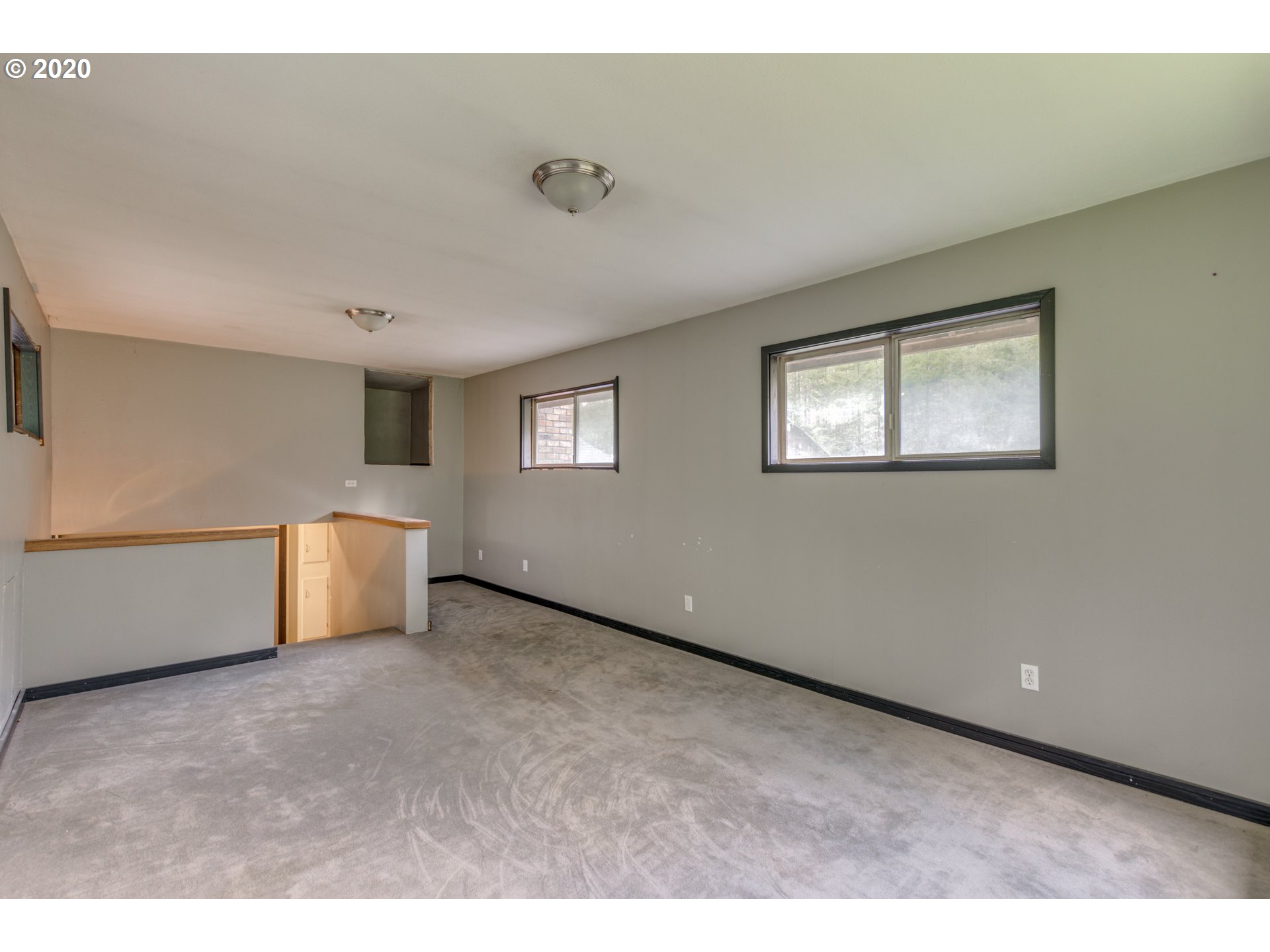 8767 Southeast Bull Run Road Corbett, OR 97019 - Photo 23 of 32 a view of an empty room with a window