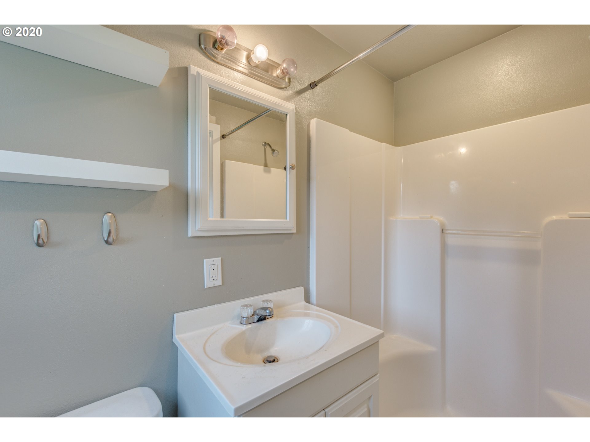 8767 Southeast Bull Run Road Corbett, OR 97019 - Photo 26 of 32 a bathroom with a sink mirror and vanity