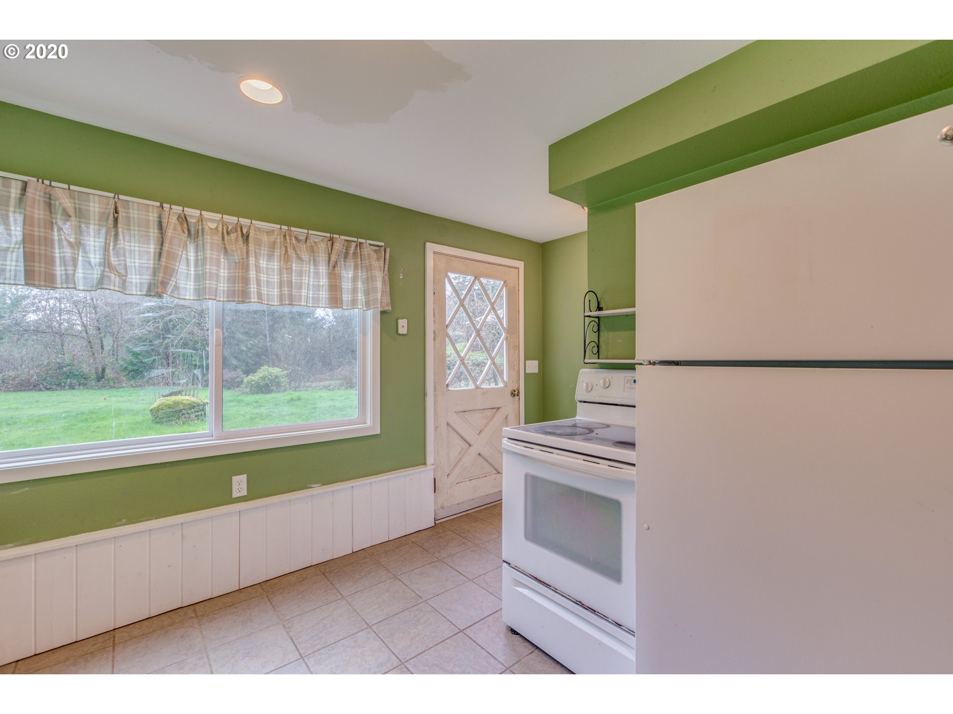 8767 Southeast Bull Run Road Corbett, OR 97019 - Photo 29 of 32 a kitchen with a refrigerator and a sink