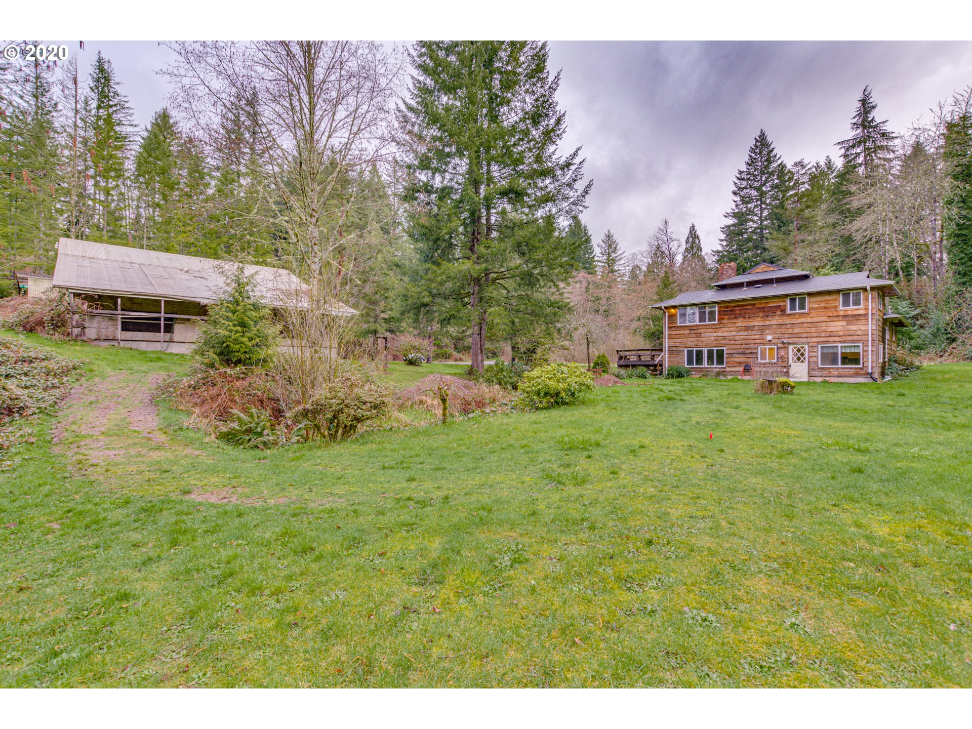 8767 Southeast Bull Run Road Corbett, OR 97019 - Photo 7 of 32 a view of a house with a big yard