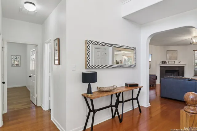 a dining room with furniture and wooden floor