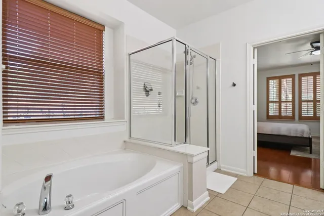 a bathroom with a bathtub and a shower