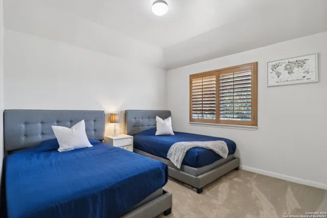 a bedroom with bed and a couch